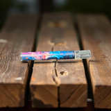 Colorful smoking device on wooden surface