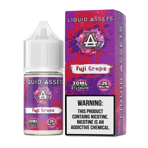 A product image showing a 30mL bottle of Liquid Assets Fuji Grape flavored e-liquid, with a concentration of 25mg. The packaging is predominantly purple and pink with graphics of grapes and apples.