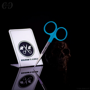 Blue scissors with a stand displaying 'Razor's Edge' logo on a black background