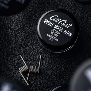 Coil Clean Small Mass Alien coil on a textured black surface