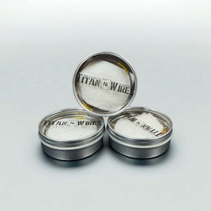 Three metal containers with 'Titan Ni Wire' on a light gray background