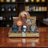 Colorful skull-themed tobacco grinder in a wooden display box on a wooden surface.